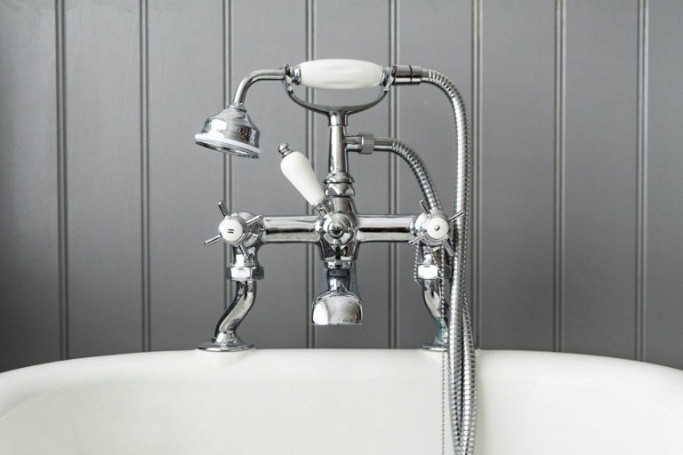 Polished chrome bath tap and shower fittings